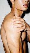 Man rubbing his shoulder