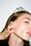 Hand on cheek — TMJ tension