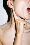 Person touching their jaw â TMJ pain
