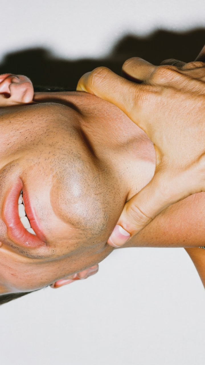 Close up video of a white man, nose to throat,, rubbing his throat and jaw